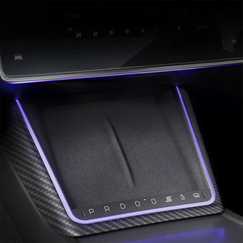 Center console button panel insert with illuminated edge lighting and carbon-fiber pattern