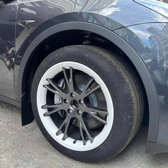 Dark gray wheel rim protector fitted on a multi-spoke alloy wheel