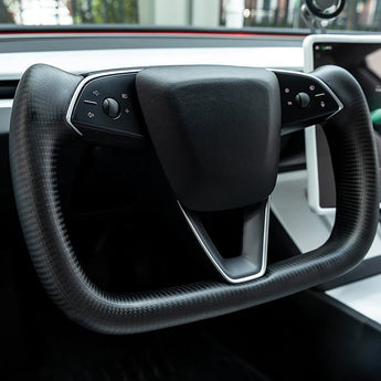 Installed heated steering wheel yoke with black carbon fiber grips and control panel