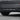 Rear bumper diffuser, dark black finish with three vertical fins