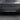 Rear bumper diffuser trim with three vertical fins, dark black