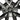 Arachnid-style wheel cover detail with satin black spokes and center hub
