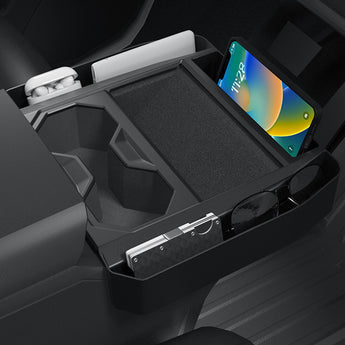 Black center console organizer holding a smartphone and sunglasses in side compartments