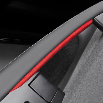 Red Alcantara door handle wrap strip on gray interior trim with protective edge