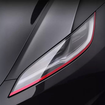 Front headlight trim film with a red border around the clear headlamp lens