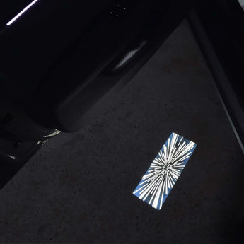 Tesla door projector puddle light projecting a blue-and-white HD logo on ground