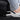 Rear seat rail corner protector under edge of seat near driver-side floor