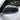 Glossy black carbon fiber side mirror cover on a white car