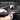Tesla Model Y side trunk upper protectors, peel-and-stick pieces being applied by hand