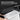 Tesla Model Y side trunk upper protector with storage bin placed on the protected area