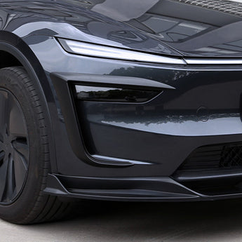 Matte black fog light trim cover with layered edge styling on bumper
