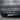 Rear bumper diffuser with three fins and reflective silver trim