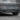 Installed rear bumper diffuser with three fins, dark black finish