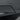 Rear bumper diffuser corner trim with smooth dark surface