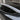 Tesla Model Y side window rain guard visor with dark trim along the door window edge