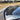Rear lip spoiler in dark finish along trunk lid, curved sporty wing