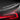 Glossy carbon-fiber performance spoiler lip, black weave finish