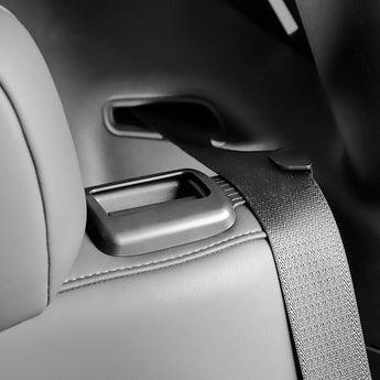Seatbelt stopper strap secured across the seat near the side latch