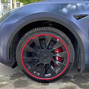 Nylon wheel rim protector with red border around a dark alloy wheel.