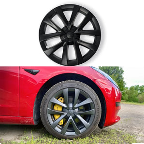 Black multi-spoke wheel cover with aero hub on car wheel with tire