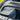 Large gray insulated cooler bag with zipper and side pocket in a car frunk