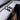 Gray felt console insert with black pronged hanger holding a paper bag by twine
