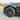 Dark black wheel cover with multi-spoke design on front tire