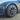 Dark turbine-style aero hubcap installed on wheel
