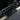 Black under-screen organizer tray with textured non-slip surface