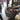 Nylon wheel rim protector shown on a mounted alloy wheel in a shop.