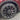 Wheel rim protector cover along alloy wheel outer rim edge with tire and red brake caliper