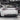 Carbon fiber rear diffuser installed on a white car with vented rear trim