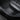 Set of carbon fiber-style door sill protectors with Model Y labels, black textured trim