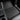 Black molded floor mat with long grooves and textured surface for all-weather coverage