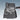 Black floor mat with water-shedding ridges and channels for wet-weather protection