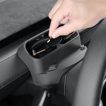 Car center console organizer holding phone accessories, dark gray cradle