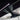 Carbon fiber shift button trim cover with gear icons shown inside console area
