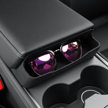 Black center console sunglasses holder with two open slots for glasses