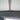 Grey sunroof sunshade with vertical seam and center securing tab
