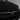 Carbon fiber front bumper inlay on vehicle front, glossy V-shaped design