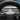 Dual steering wheel lever stalks with function labels, mounted on Tesla steering wheel.