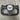 Black steering wheel yoke with exposed mounting frame and carbon-fiber center insert