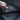All-weather floor mat, dark textured rubber with raised channels and button grommets