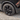 Black wheel rim cover on front wheel with full rim ring and center hub