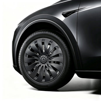 Close-up of 18-inch turbine-style wheel cover installed on Tesla Model Y Standard
