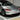 Tesla Model 3 front corner with red LED DRL-style strip, headlight upgrade kit