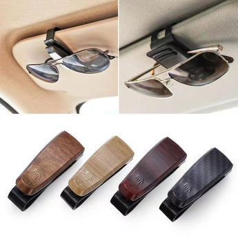 Sunglasses holder for car interior with black base and wood-look insert, holding glasses