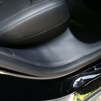 Black car door sill protector with scuff guard along interior threshold