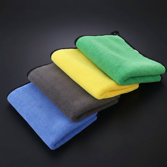 Microfiber car wash towels, folded set in yellow, green, gray, and blue.