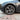 Gunmetal grey multi-spoke 19-inch wheel cover on tire with center cap